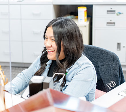 PCB employee greeting a customer