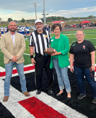 four people at a football game