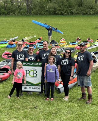 group of people with kayaks