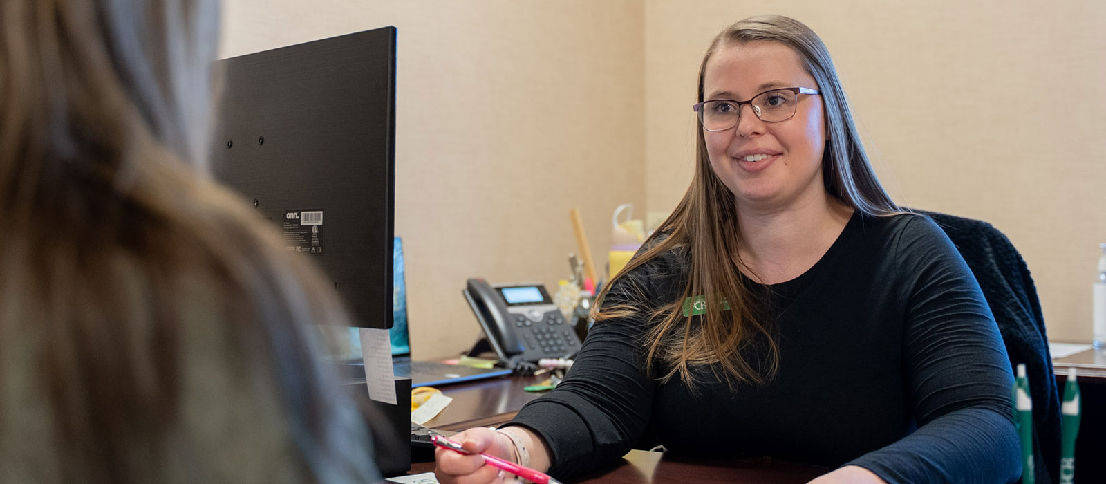 A PCB employee helping a customer