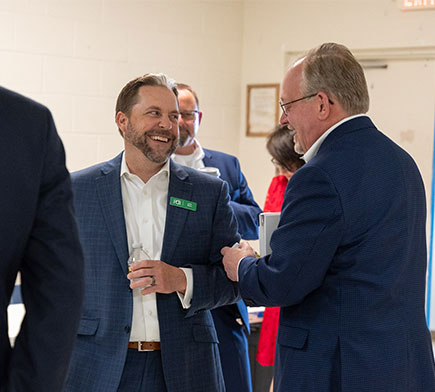 Two people laughing and talking