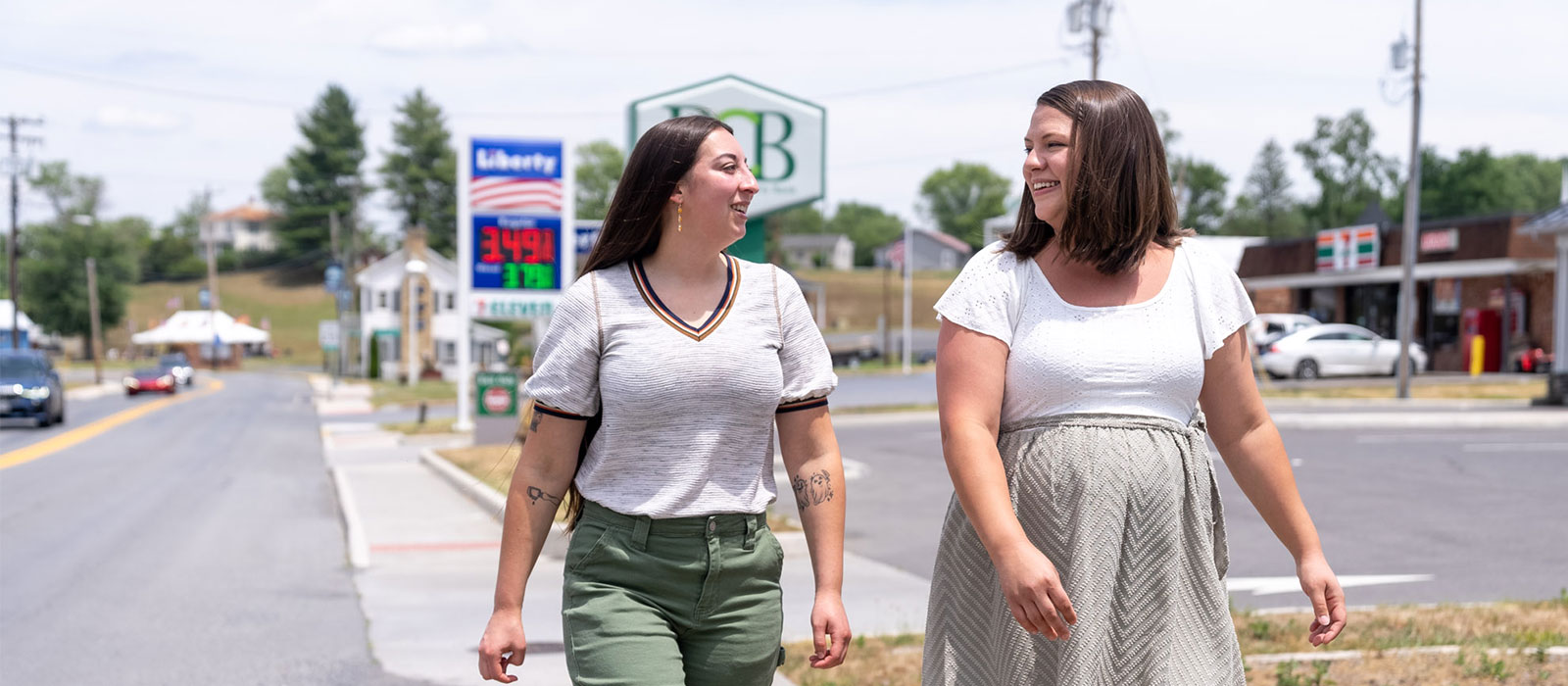 Two people walking down main street