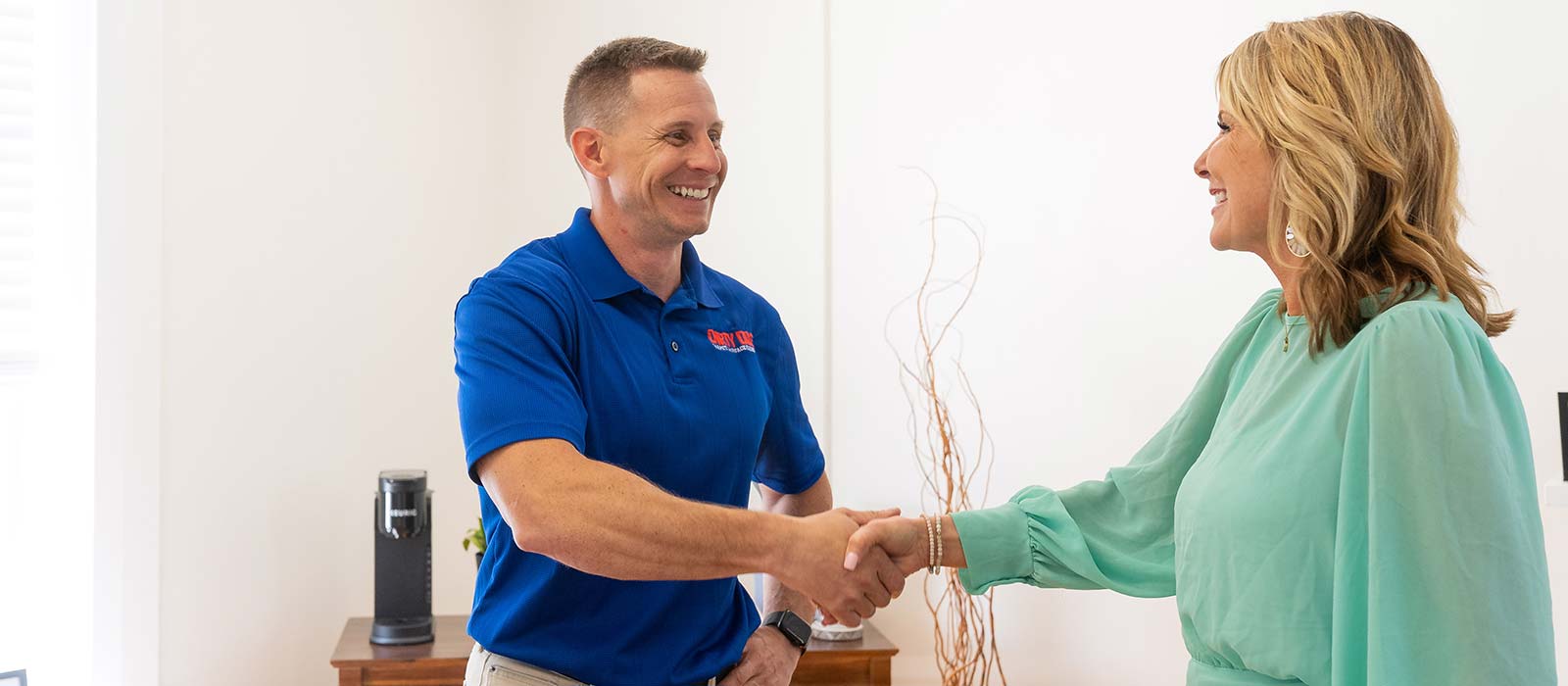 man and woman shaking hands