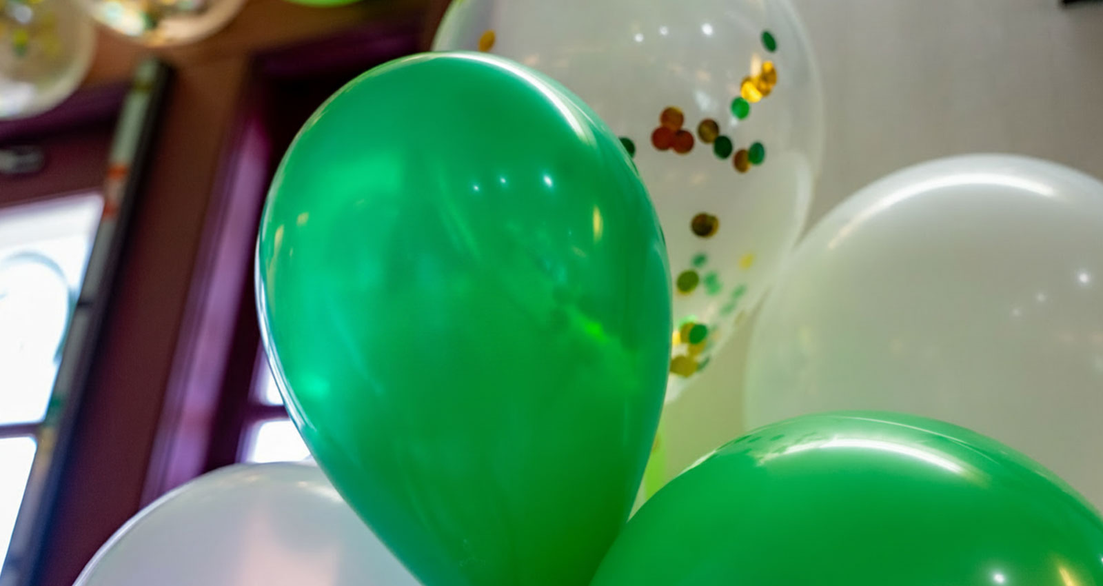 Green and white balloons