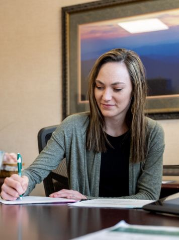 A person filling out paperwork