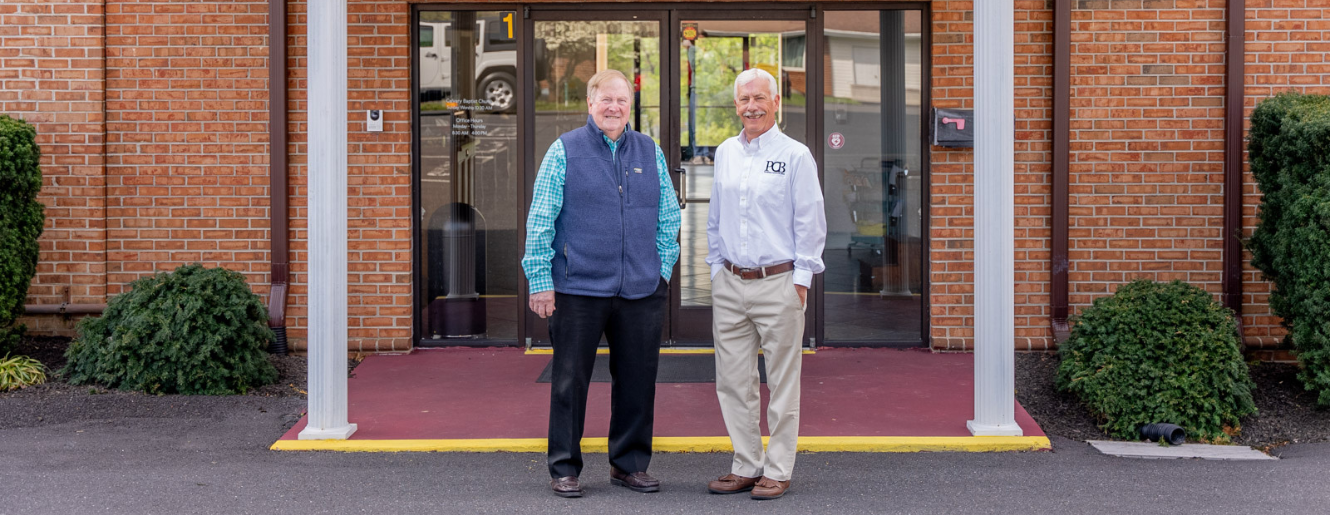 Two men outside church