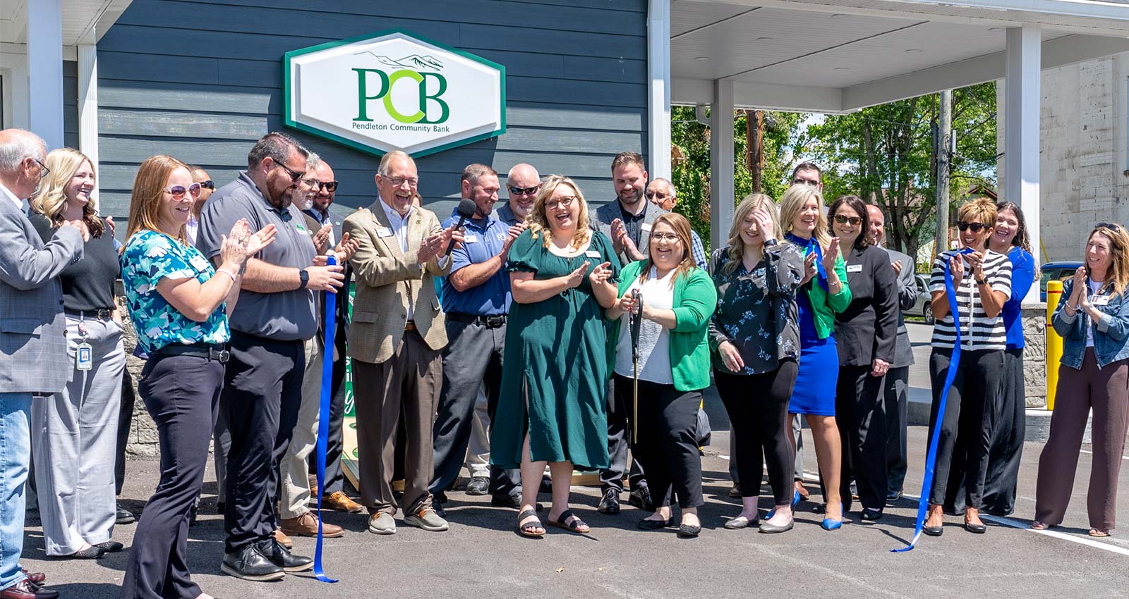 Group of people at a ribbon cutting