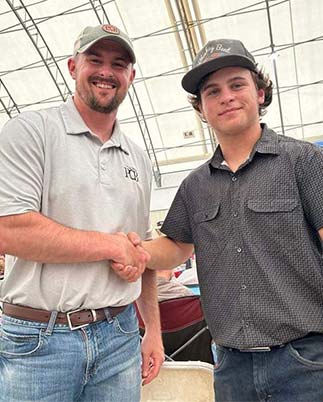 PCB employee and young man shaking hands