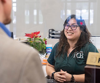 Teller smiling at customer