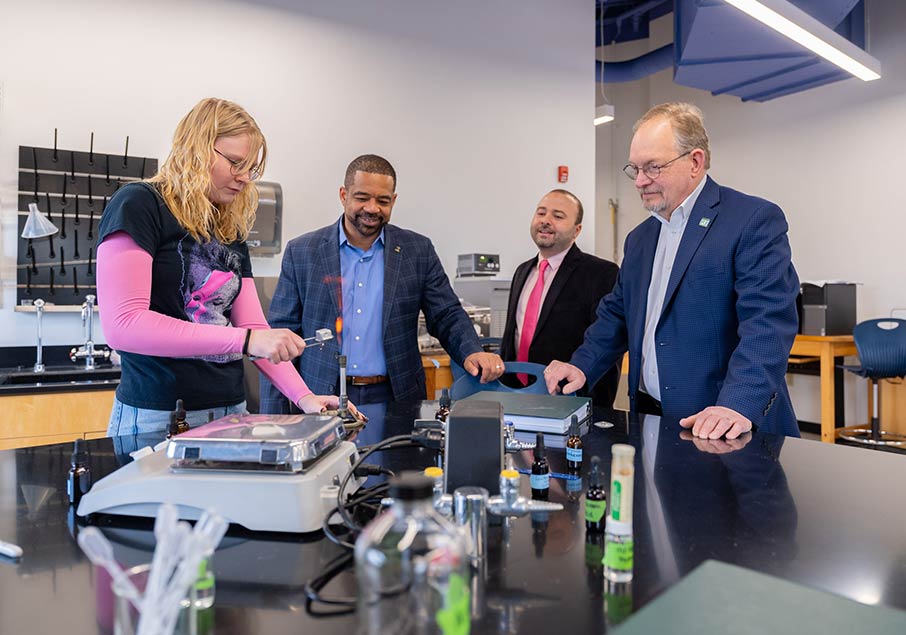 Four people in a lab