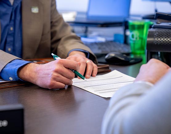 People completing paperwork