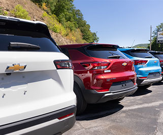 back of white, red, and blue vehicles