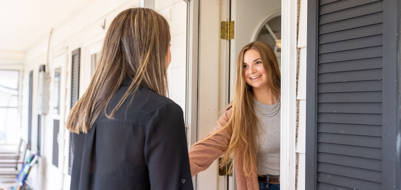 Person opening the door to their home