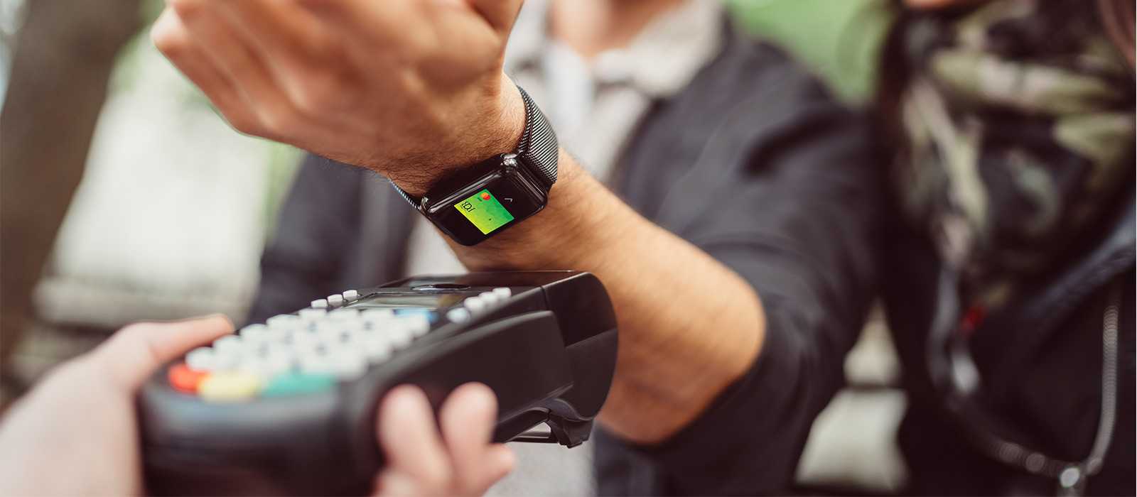 person paying with mobile wallet 